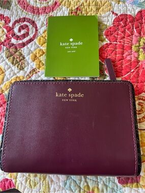 kate spade Burgundy Leather Zip Wallet with Gold Logo